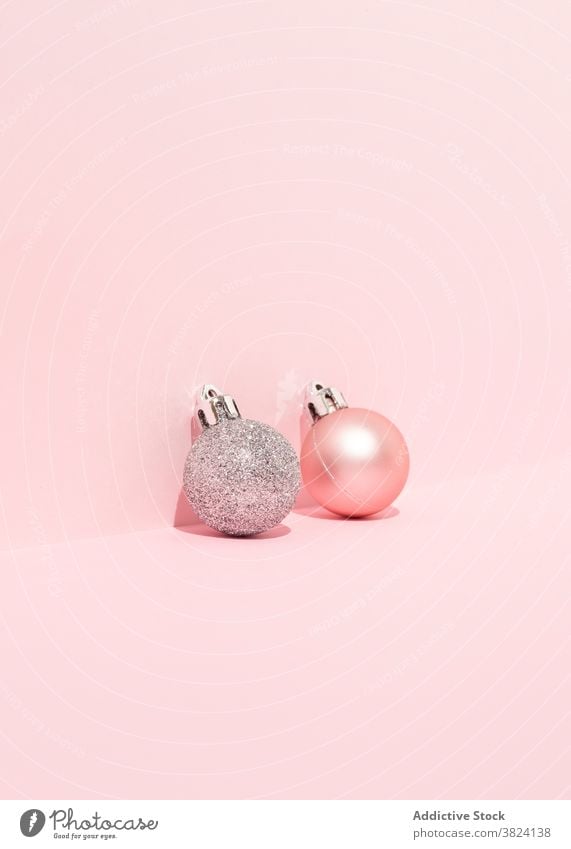 Various shiny balls on table in studio christmas bauble background holiday decoration color pink celebrate festive tradition winter event bright new year season