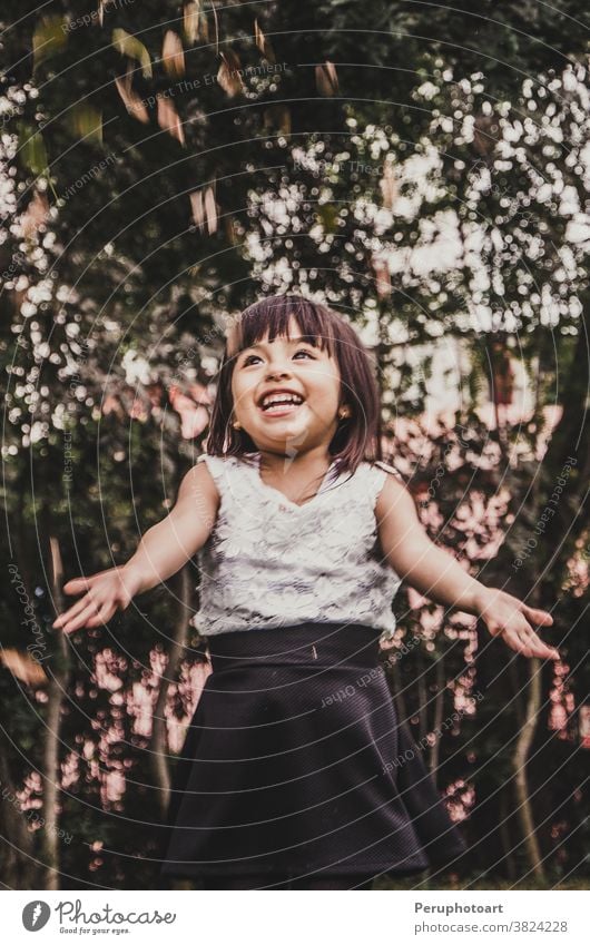 Little cute short-haired girl throws leaves autumn people happy child fall park cheerful forest golden little nature outside playful yellow laugh funny positive