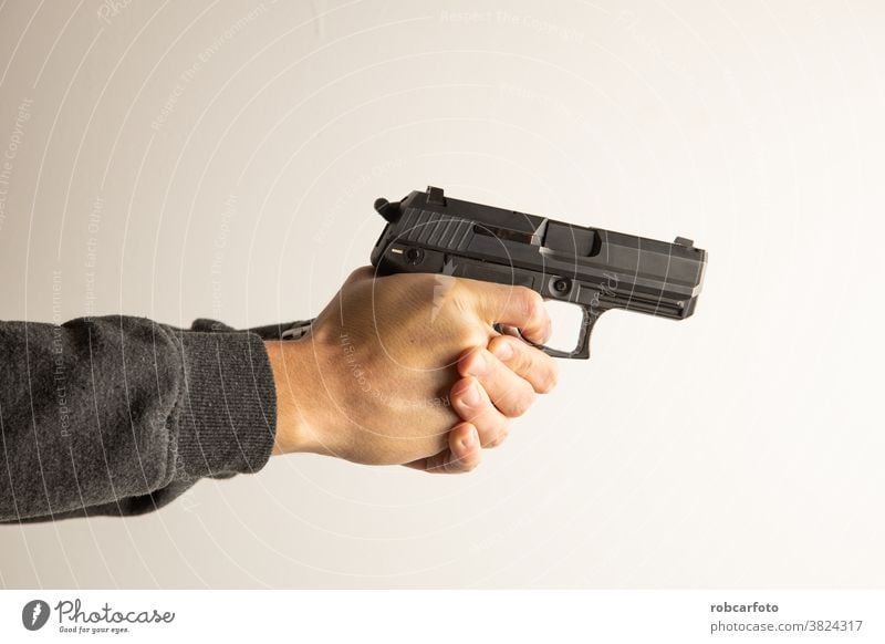 https://www.photocase.com/photos/3824317-man-with-black-pistol-gun-handgun-police-violence-photocase-stock-photo-large.jpeg