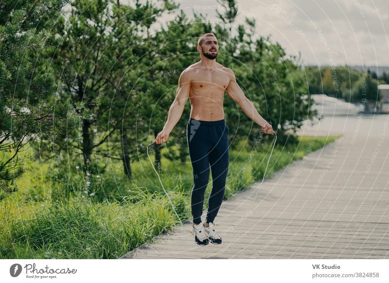 Fashion male model posing outdoor in summer scenery. Handsome ma Stock Photo  | Adobe Stock