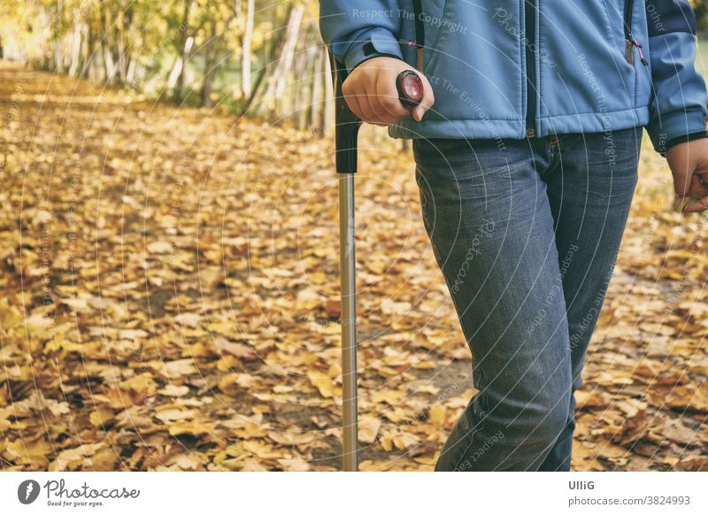 Young Girl With Crutch In Autumn - Young teenage girl with a crutch walks through coloured fallen leaves in autumn. teenager young leg female leg injury