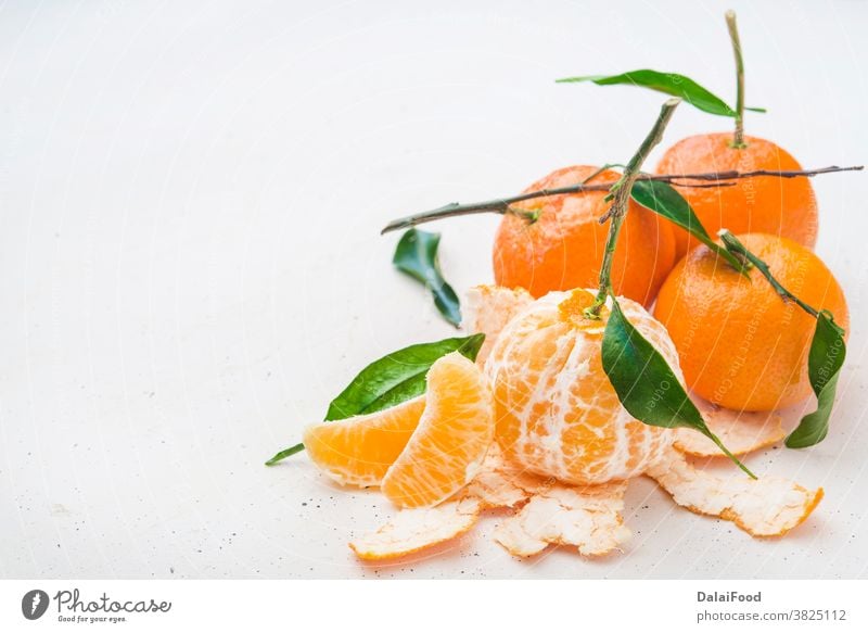 Tangerine fresh  with leaves close up agriculture breakfast citrus closeup food fruit green group harvest healthy leaf mandarin natural nature needle object