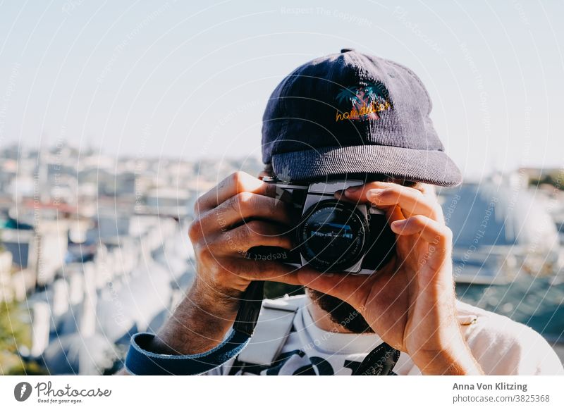 Analogue photography Photography cap Sunlight Single-lens reflex camera hands Man Town City trip Male Hands Hipster Camera Summer travel Travel photography