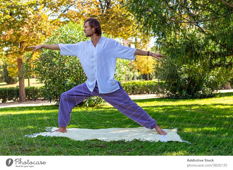 Young woman relaxing in yoga lotus pose at garden - Stock Image - F033/8761  - Science Photo Library