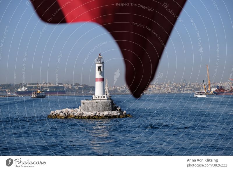 Lighthouse - Bosporus The Bosphorus Ocean Navigation Maritime flag Red white red ship Harbour Blue sky depth blur Blow crane port Istanbul Turkey tankers