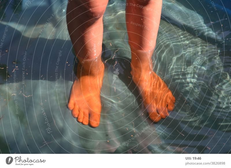 Feet cool in water. feet Child Water reflection Bathtub water Evening sun Summery bathe refreshingly Reflection in the water Play of colours relaxed