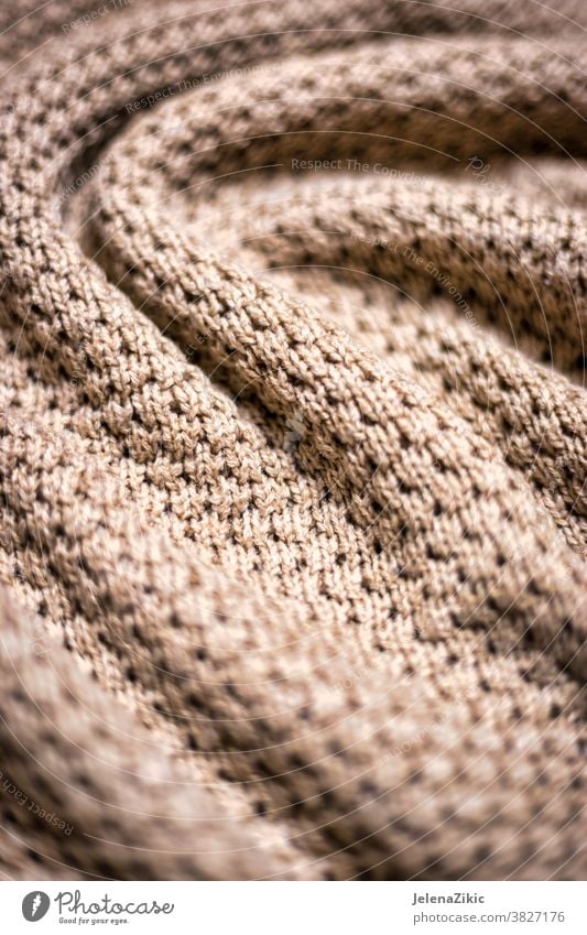 Aesthetic beige yarn skein on wooden background, Stock image