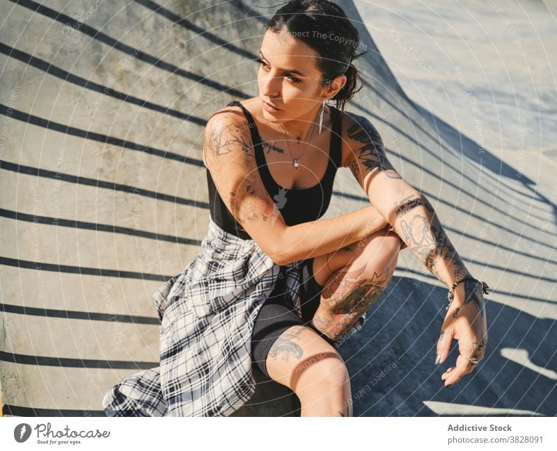 Serious woman on bike in skate park - a Royalty Free Stock Photo from  Photocase