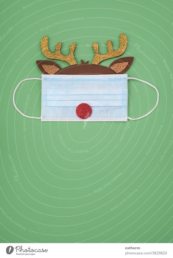 Merry Christmas.Christmas concept background.Christmas Rudolph Reindeer with protective surgical mask christmas santa claus coronavirus reindeer