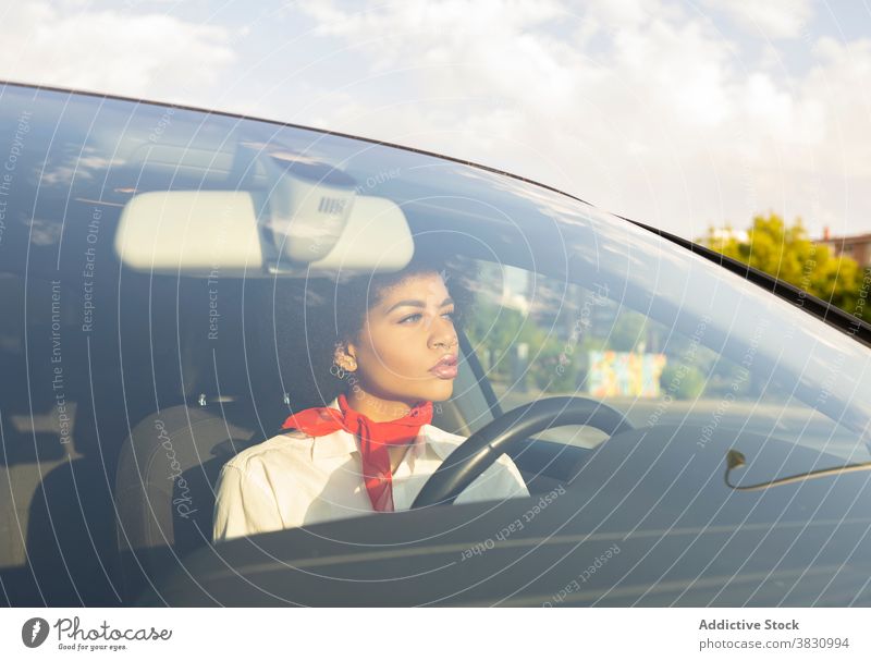 Serious black woman driving car driver serious confident busy work female transport thoughtful automobile lady african american communicate road device gadget