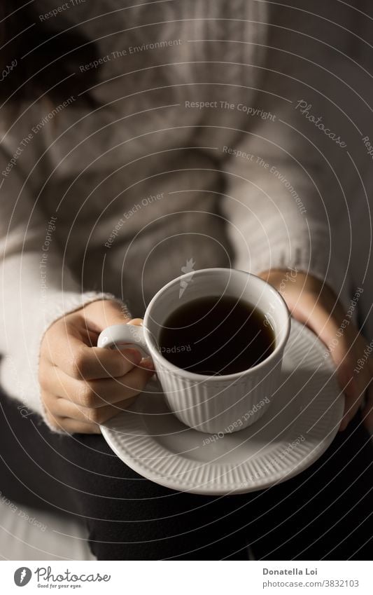 Girl holding a cup of tea alone close up concept drink female girl hand hands health health care home indoor indoors lifestyle liquid moment one person