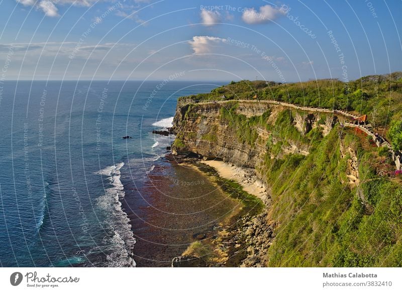 View on the coastline near Uluwatu temple on Bali Indonesia uluwatu bali beautiful cliff indonesia landscape nature ocean sea sky summer travel water wave beach