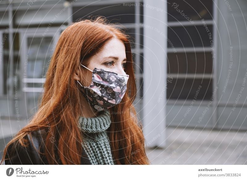 young woman wearing homemade everyday cloth face mask outdoors in city real people lifestyle corona winter authentic community mask coronavirus covid covid-19
