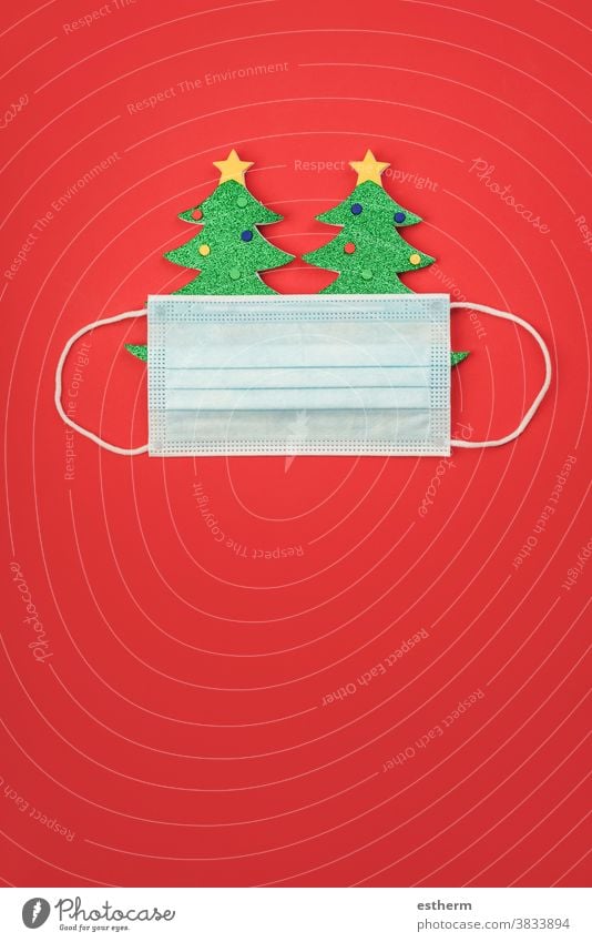 Merry Christmas.Christmas concept background.Christmas tree with protective surgical mask christmas santa claus coronavirus christmas tree banner
