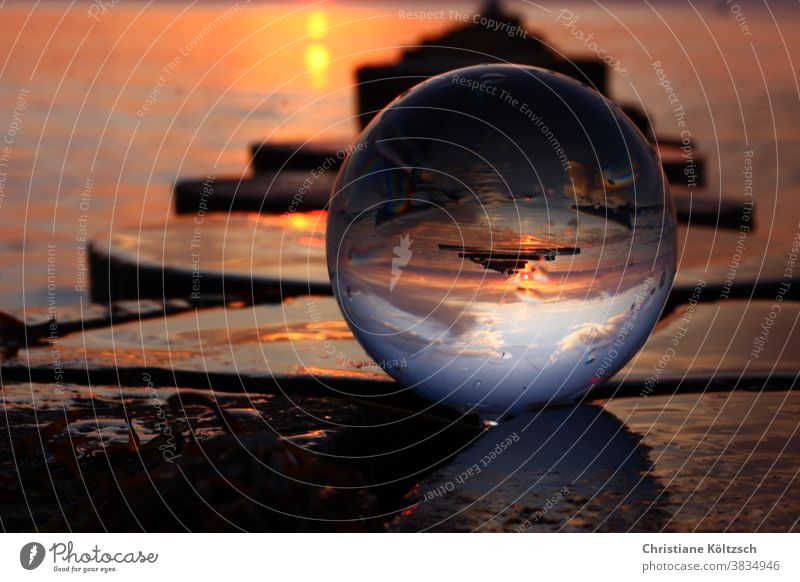 Sunset in the glass ball at the sea of Hiddensee Glass ball Glass ball photography Ocean Beach groynes Warmth Dynamics coast Baltic Sea Clouds Landscape