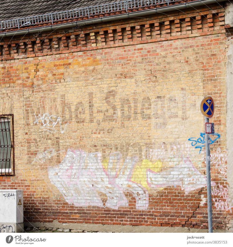 furniture, mirrors and upholstery Facade Past Advertising Nostalgia Ravages of time Lettering Weathered clinker Change absolute ban on holding Graffiti