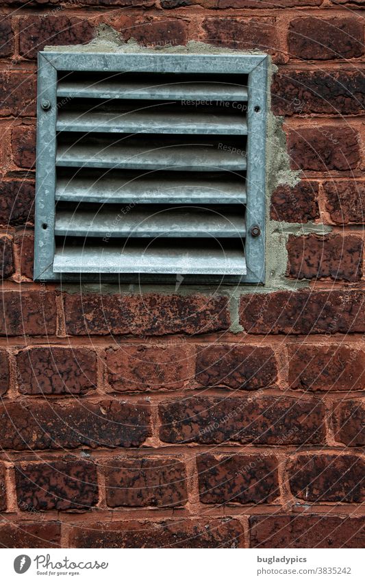 Ventilation grille in an old brick wall. Brick Brick wall ventilation grille Facade Wall (building) Structures and shapes Manmade structures Building Stone