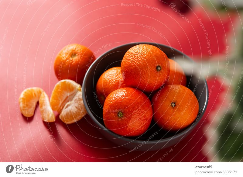 Fresh tangerines in bowl asian blue chinese citrus clementine food fresh fruit healthy isolated juice macro mandarin natural nature new year orange organic