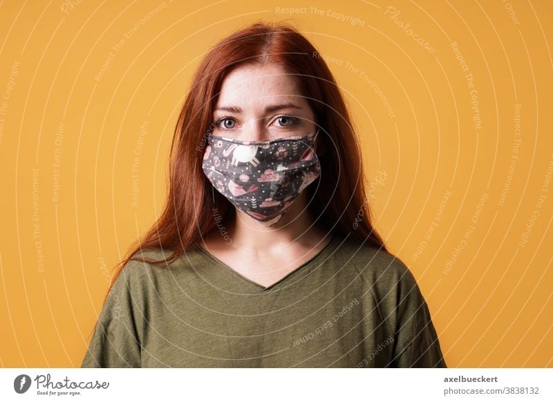 young woman wearing homemade cloth face mask or community mask everyday mask corona coronavirus covid-19 people hygiene health care portrait epidemic protection