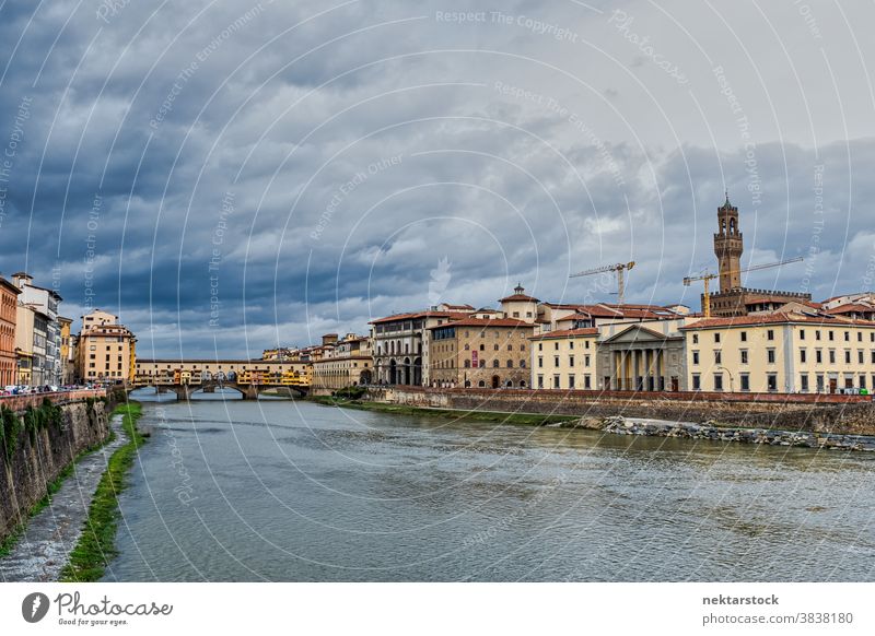 Arno River with Architecture in Florence Italy skyline overcast cloud water flow architecture buildings urban city Tuscany Europe day natural lighting travel