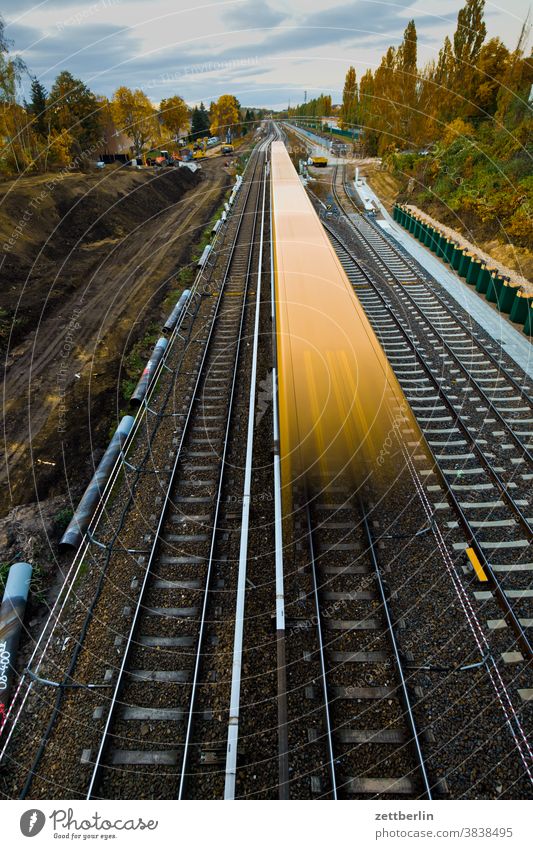 Moving S-Bahn on the construction site of the Dresdener Bahn, Berlin-Lankwitz Track Construction site professional traffic motion blur German Railway