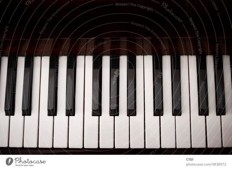 Black and white keys of a classical piano. aerial shot. keyboard musical black scale note instrument octave grand play harmony top sound musical scale acoustic