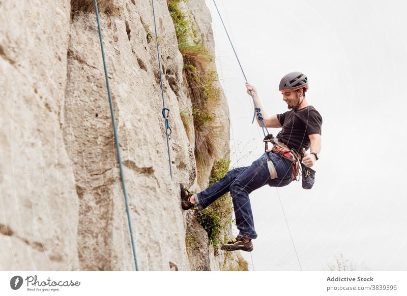 Man Climbing Cliff Belt Stock Photos - Free & Royalty-Free Stock Photos  from Dreamstime