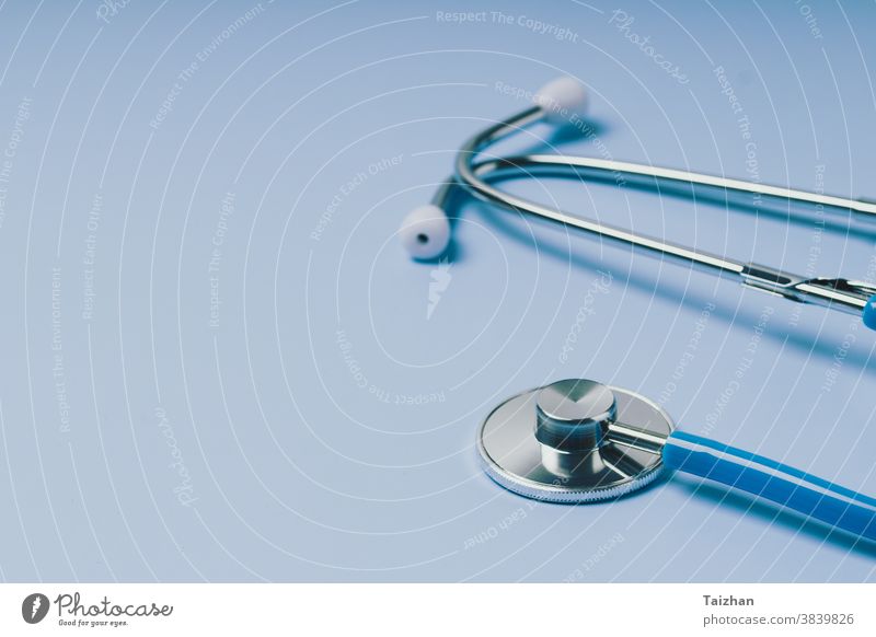 https://www.photocase.com/photos/3839826-close-up-of-blue-stethoscope-of-doctor-for-checkup-on-blue-background-photocase-stock-photo-large.jpeg