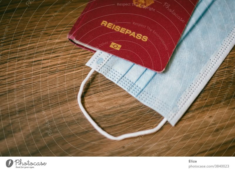 Passport with a mouth guard. Travel during Corona. Travel pass corona Mask Travel Restriction vacation travel pandemic Disposable mask Risk area coronavirus
