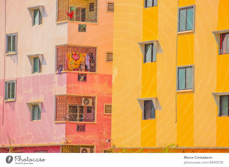 Close up of generic apartment buildings with bright colored walls in Bangkok City anime look colorful buildings urban residential area real estate