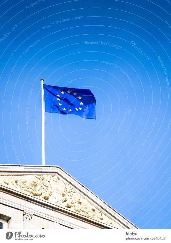 European flag , Flag of the European union waving in the wind against a bright blue sky EU Wind Blue Politics and state European Union historical building