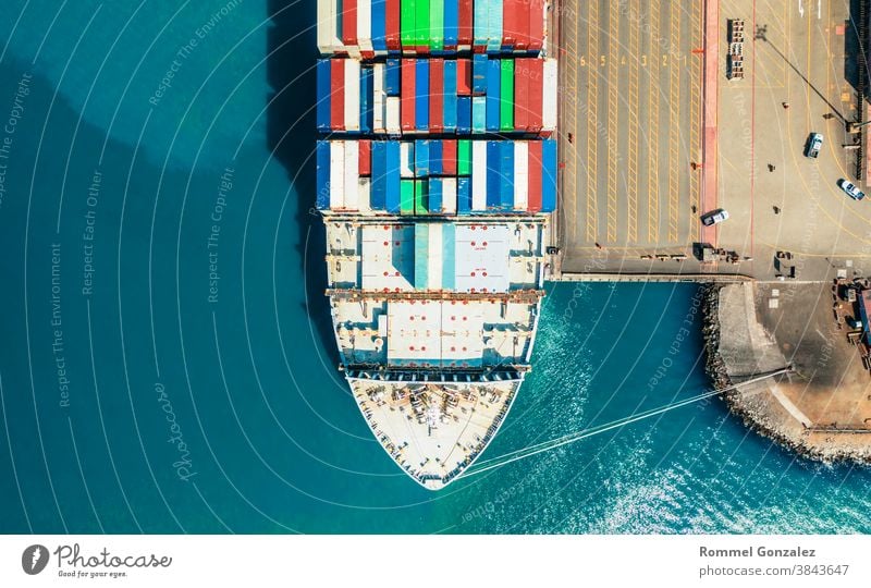 Aerial view container ship carrying container in import export business logistic and transportation of international by container ship in the open sea, with copy space.