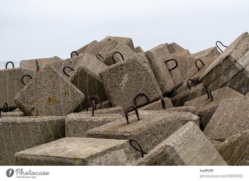 Concrete blocks as coastal protection Tidal barrier coastline Climate change Storm damage Waves Environment Gale Autumn Water Ocean Beach causeway North Sea