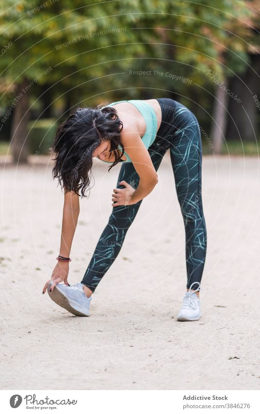 Athletic black woman doing exercises on street - a Royalty Free Stock Photo  from Photocase