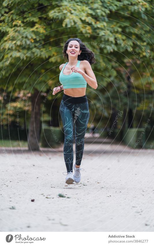 Young woman running in summer park - a Royalty Free Stock Photo from  Photocase