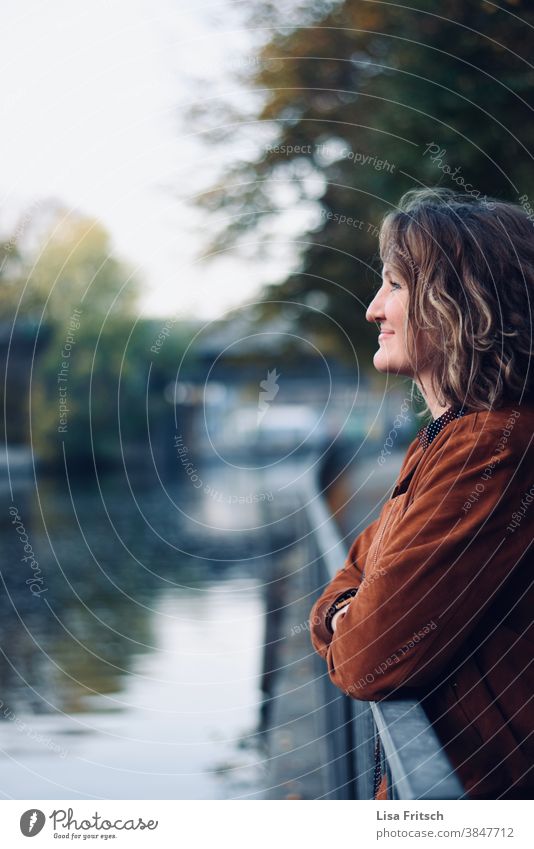 BEAUTIFUL VIEW - GRIN Woman Curl Lean Water Reflection in the water reflection trees Autumn Autumnal Brown 30-35 years old Grinning cheerful contented