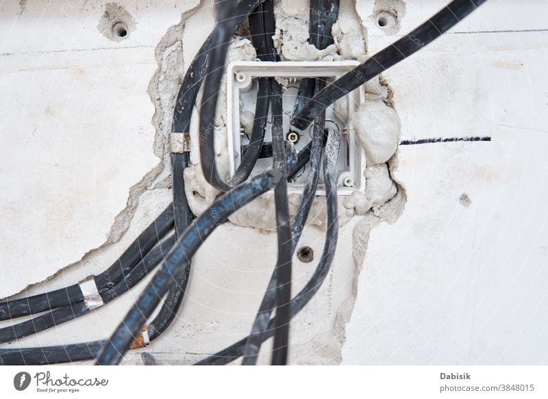 Socket for wiring in a concrete wall. Renovation concept - a