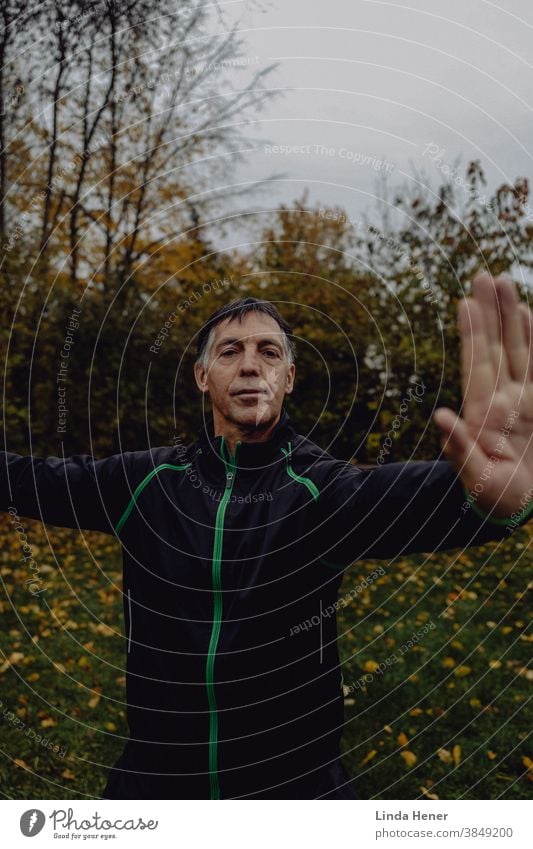 Qi Gong exercise on the meadow in autumn qi Qi gong Qigong Attentive Calm Serene Nature Day Exterior shot Practice Relaxation Zen Healthy Meditation Wellness