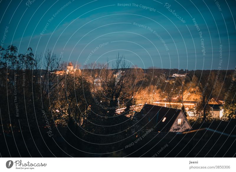 Lights shine in the dusk of the city Town Downtown Dusk Blue blue hour Twilight clearer Illuminated Street Evening Sky Blue sky evening mood evening light