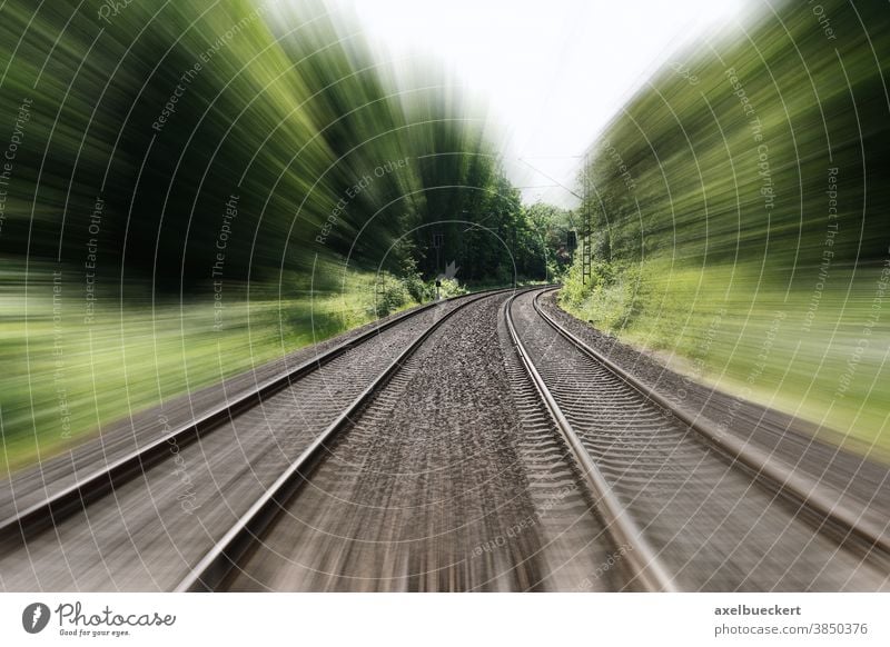 double-track railroad railway or train tracks speed motion blur travel moving fast journey traveling transportation distance vacation landscape nature trees