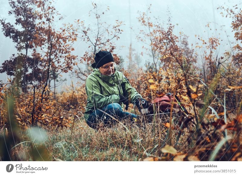 https://www.photocase.com/photos/3851015-woman-with-backpack-having-break-during-autumn-trip-drinking-a-hot-drink-from-thermos-flask-on-autumn-cold-day-photocase-stock-photo-large.jpeg