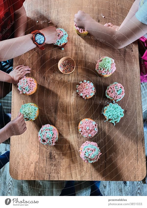 Children baking cupcakes, preparing ingredients, decorating cookies children cooking bake family domestic muffin together childhood happy little kid kitchen