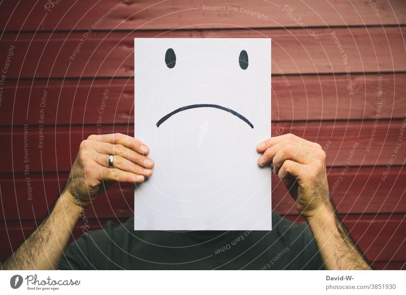 man recorded with sad facial expression - negative smiley on a piece of paper Face Smiley Facial expression Evil Emotions embittered Piece of paper drawing