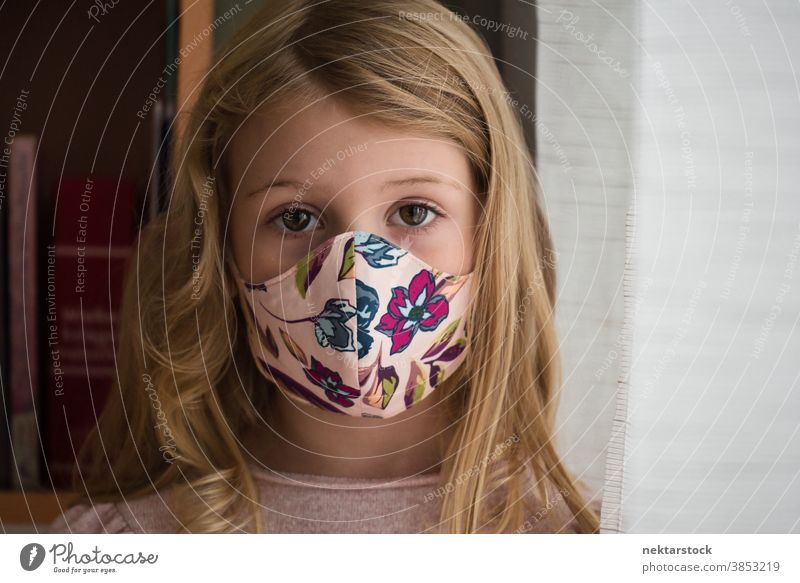 Portrait of Little Blond Girl Wearing Protective Face Mask child girl portrait mask protective face mask blond caucasian lifestyle female looking at camera