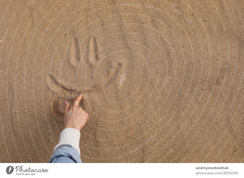 Hand Drawing a Beautiful Cute Smile in Desert Sand - Background smile foot sand holiday fun texture face beach symbol sun joy lifestyle sunny day enjoying