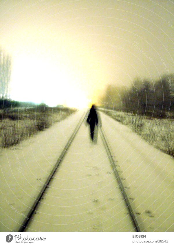 the aisle into the light #2 Loneliness Cold Railroad tracks Human being Snow railway embankment Shadow