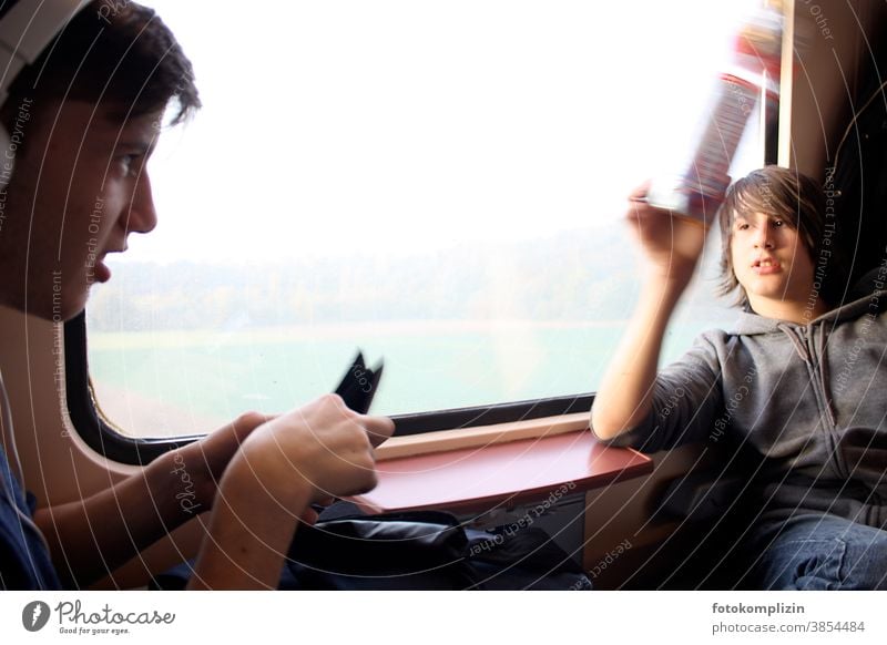 two boys at the window in the train Railroad Passenger train Passenger traffic Parenting Train compartment Student go by train train window Infancy