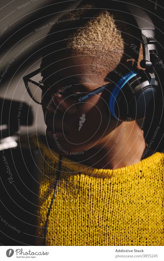 Positive female radio host in studio - a Royalty Free Stock Photo from  Photocase