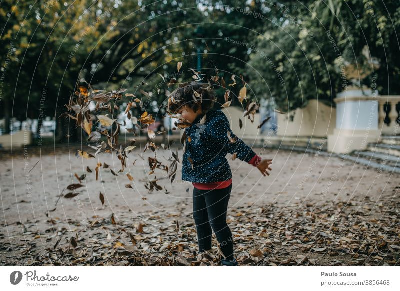 Little girl playing with autumn leaves Autumn Autumn leaves Autumnal Child childhood Children's game Playing Happy Happiness Day 1 - 3 years Exterior shot