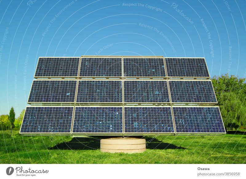 Solar collector on a green meadow against a clear blue sky Solar Power Solar cell Energy Energy industry Force power station power supply Renewable energy